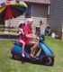 Daddy and I taking a ride on my kindergarden teacher's bike. We each got a turn, even Mama!